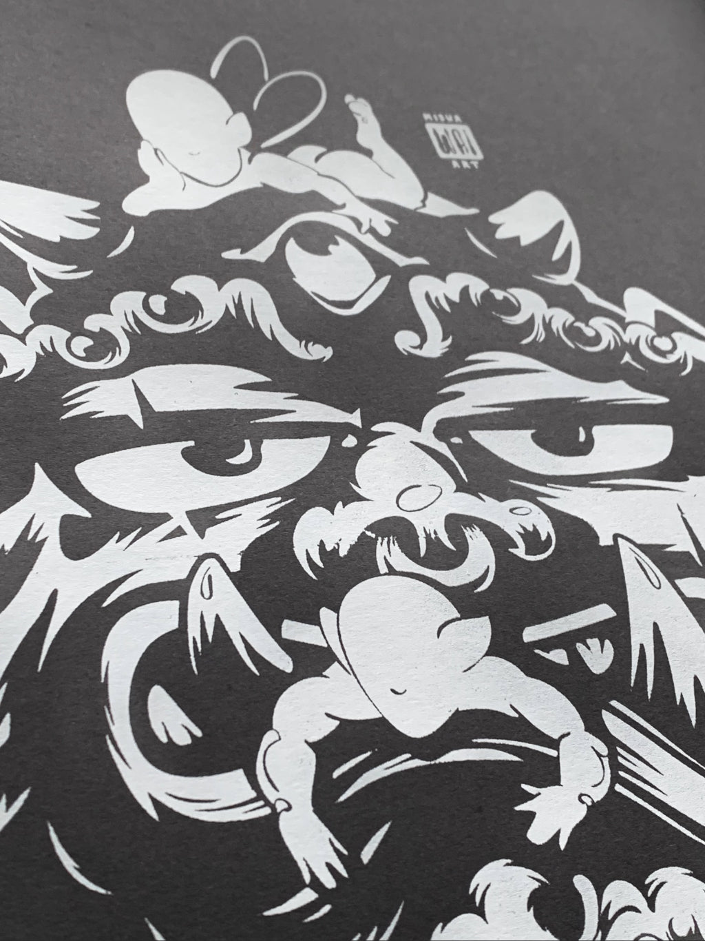 A close-up image of Asian creature stuck around by faceless elves printed with white water-based ink on black paper.